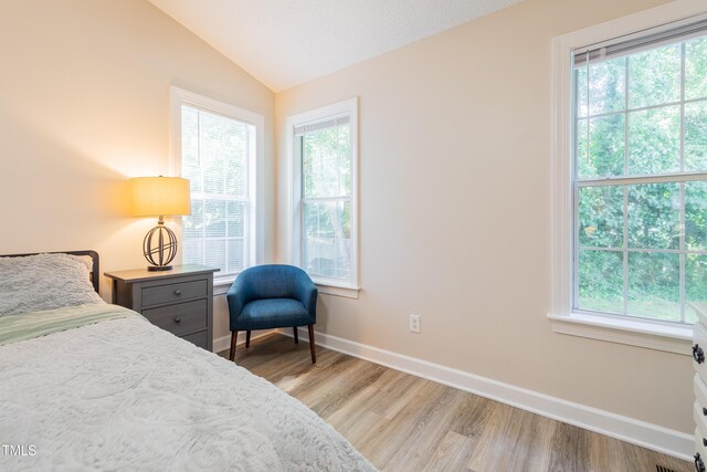 358 Tillamook Dr, Wake Forest, NC 27587 - bedroom with vaulted ceiling, light wood finished floors, and baseboards