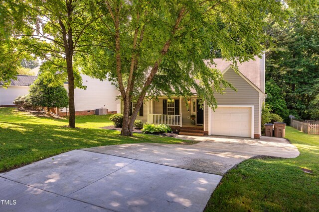 358 Tillamook Dr, Wake Forest, NC 27587 - view of front of home with covered porch, concrete driveway, a front lawn, and central air condition unit