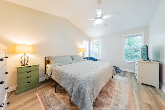 358 Tillamook Dr, Wake Forest, NC 27587 - bedroom with multiple windows, vaulted ceiling, light wood-style flooring, and baseboards