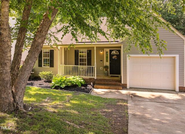 358 Tillamook Dr, Wake Forest, NC 27587 - view of front of home featuring covered porch, a garage, and driveway