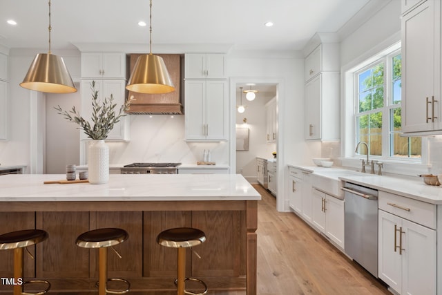 217 Dublin Rd, Raleigh, NC 27609 - kitchen featuring dishwasher, custom range hood, light wood-type flooring, tasteful backsplash, and a breakfast bar area