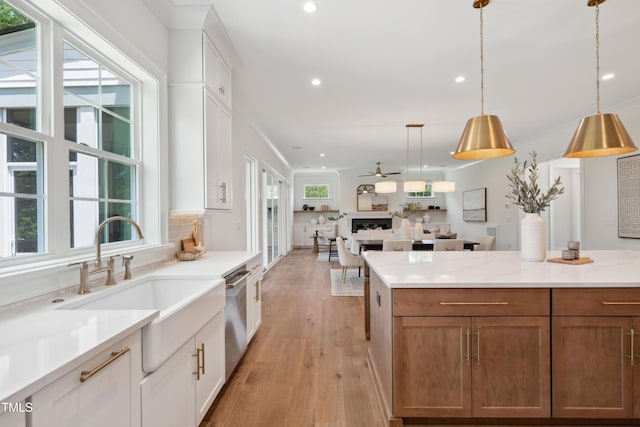 217 Dublin Rd, Raleigh, NC 27609 - kitchen featuring recessed lighting, dishwasher, light wood-style floors, light countertops, and open floor plan