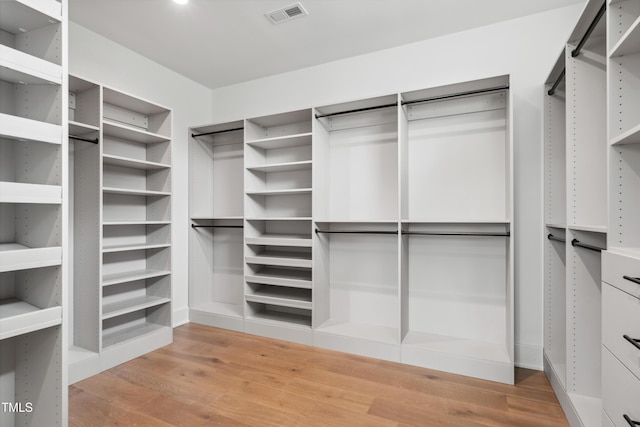 217 Dublin Rd, Raleigh, NC 27609 - spacious closet featuring light wood finished floors