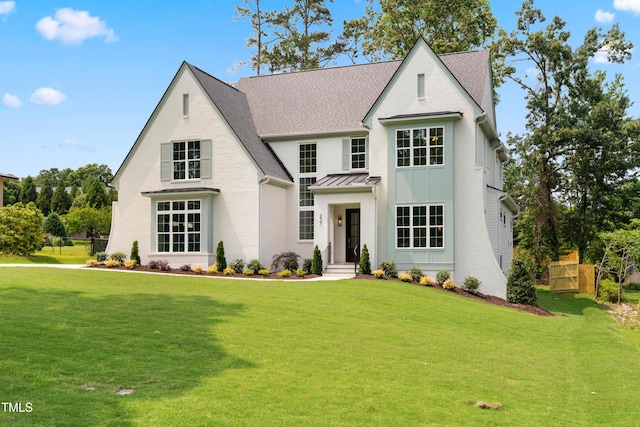 217 Dublin Rd, Raleigh, NC 27609 - view of front of house featuring a standing seam roof, metal roof, and a shingled roof
