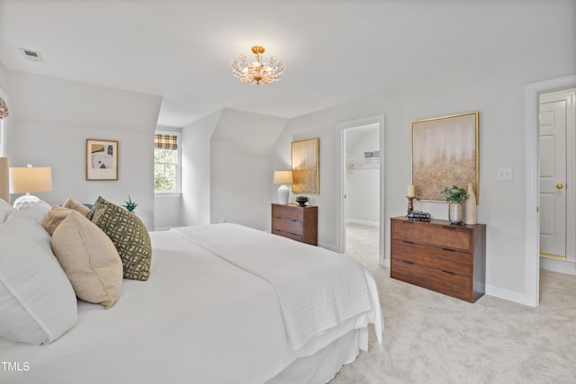314 Chanticlair Dr, Apex, NC 27502 - bedroom with light colored carpet, a walk in closet, and a chandelier