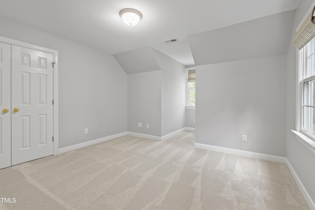 314 Chanticlair Dr, Apex, NC 27502 - bonus room featuring light colored carpet, lofted ceiling, and plenty of natural light