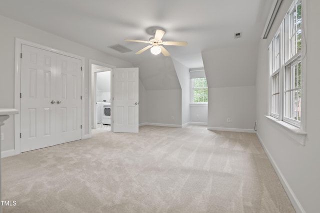 314 Chanticlair Dr, Apex, NC 27502 - bonus room featuring light carpet, washer / clothes dryer, a ceiling fan, baseboards, and lofted ceiling