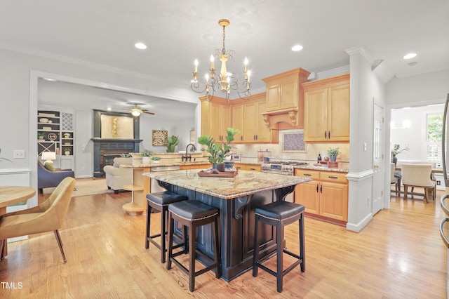 314 Chanticlair Dr, Apex, NC 27502 - kitchen with light brown cabinetry, light wood-type flooring, a peninsula, ceiling fan, and recessed lighting