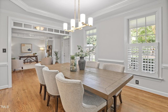 314 Chanticlair Dr, Apex, NC 27502 - dining space featuring ornamental molding, a chandelier, and wood finished floors