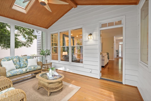 314 Chanticlair Dr, Apex, NC 27502 - sunroom featuring hardwood / wood-style flooring, a skylight, wood walls, wood ceiling, and a wooden deck