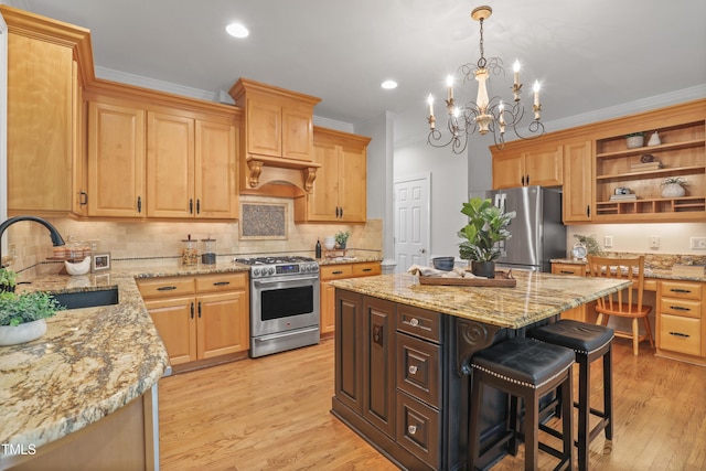 314 Chanticlair Dr, Apex, NC 27502 - kitchen with stainless steel appliances, ornamental molding, backsplash, light stone counters, and light wood-type flooring