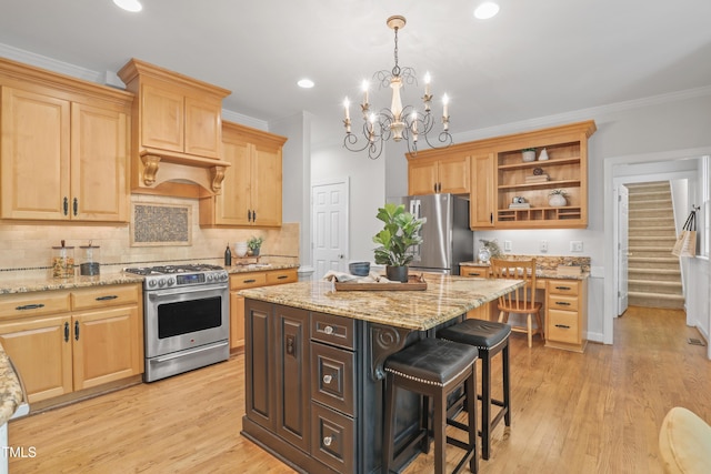 314 Chanticlair Dr, Apex, NC 27502 - kitchen with appliances with stainless steel finishes, open shelves, a breakfast bar area, light brown cabinetry, and decorative backsplash