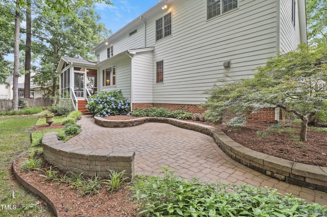 314 Chanticlair Dr, Apex, NC 27502 - rear view of property with a sunroom and a patio area
