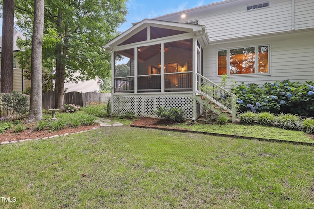 314 Chanticlair Dr, Apex, NC 27502 - rear view of house featuring a sunroom