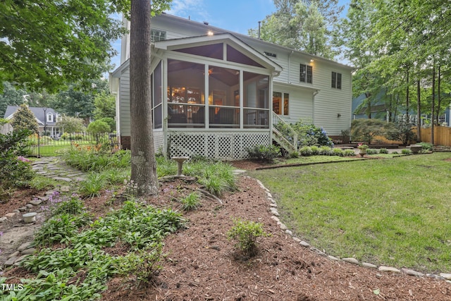 314 Chanticlair Dr, Apex, NC 27502 - rear view of house with a sunroom