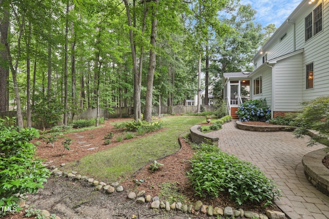 314 Chanticlair Dr, Apex, NC 27502 - view of yard with a sunroom and a patio area