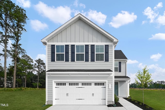 616 Impala, Wendell, NC 27591 - view of front of home featuring a garage, driveway, board and batten siding, and a front yard