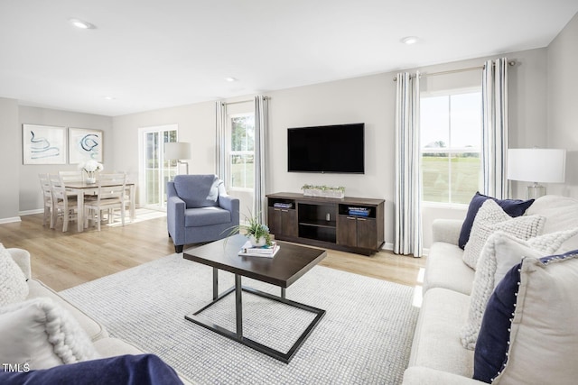 616 Impala, Wendell, NC 27591 - living room with light wood finished floors, baseboards, and recessed lighting