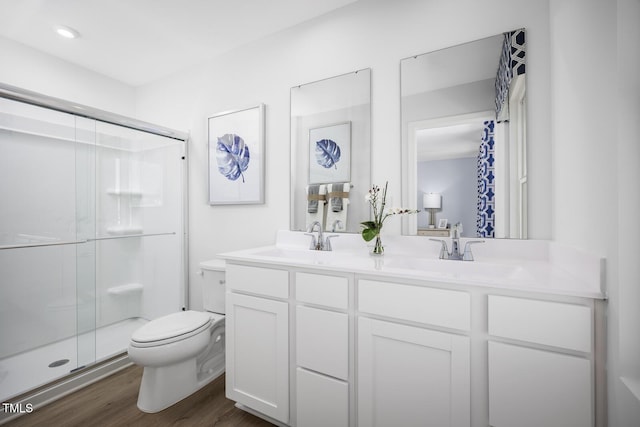 616 Impala, Wendell, NC 27591 - full bath featuring toilet, a stall shower, double vanity, and wood finished floors