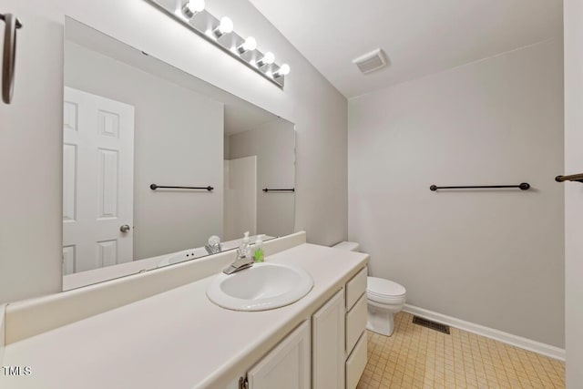 72 Justin Ct, Durham, NC 27705 - bathroom with toilet, vanity, and baseboards