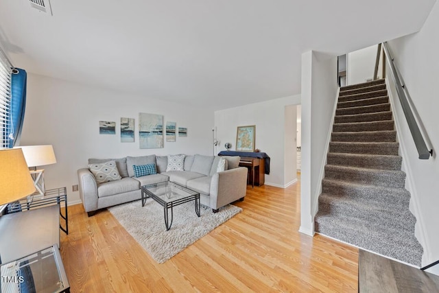 72 Justin Ct, Durham, NC 27705 - living room featuring light wood-style floors, stairway, and baseboards