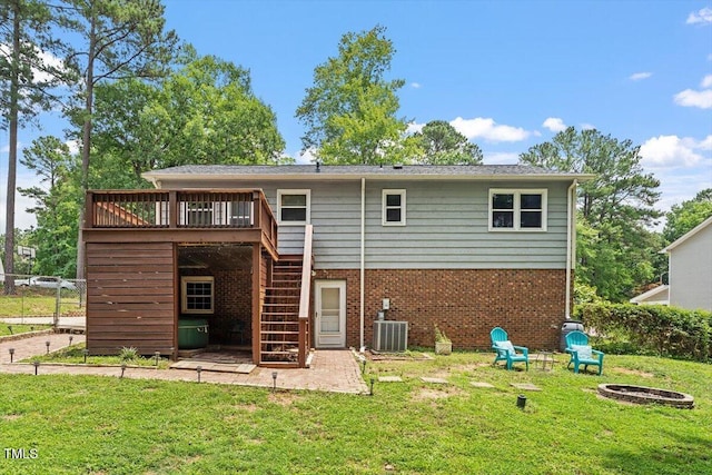 105 Otter Dr, Cary, NC 27513 - rear view of property featuring stairway, a fire pit, a deck, and brick siding
