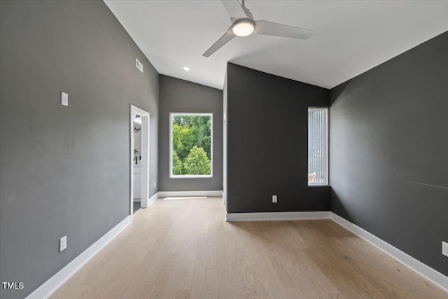 2225 Millbank Village Ct Unit 101, Raleigh, NC 27610 - unfurnished room with vaulted ceiling, wood finished floors, a ceiling fan, and baseboards