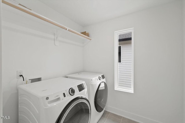 2225 Millbank Village Ct Unit 101, Raleigh, NC 27610 - laundry area with independent washer and dryer, baseboards, and light tile patterned floors