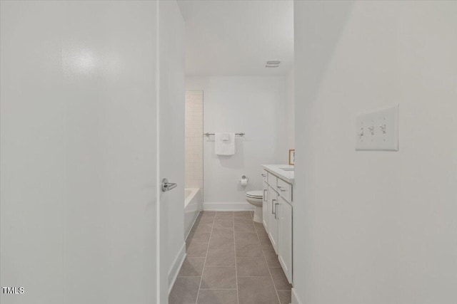 2225 Millbank Village Ct Unit 101, Raleigh, NC 27610 - bathroom featuring toilet, vanity, tile patterned floors, baseboards, and shower / bath combination