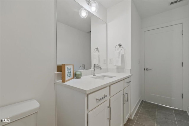 2225 Millbank Village Ct Unit 101, Raleigh, NC 27610 - bathroom with vanity, toilet, and tile patterned floors