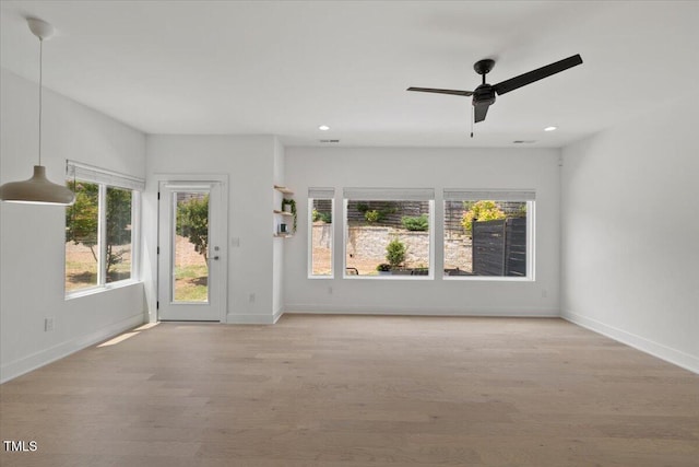 2225 Millbank Village Ct Unit 101, Raleigh, NC 27610 - empty room featuring baseboards, wood finished floors, a ceiling fan, and recessed lighting