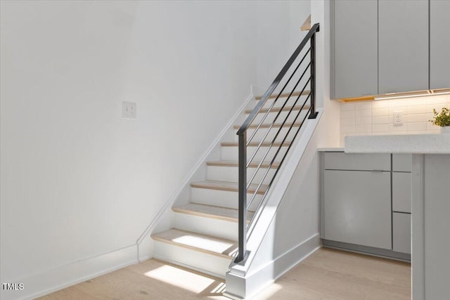 2225 Millbank Village Ct Unit 101, Raleigh, NC 27610 - stairway with wood finished floors and baseboards
