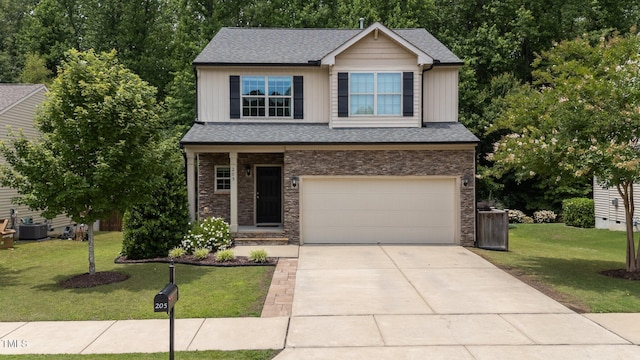 205 Willow Weald Ct, Fuquay Varina, NC 27526 - view of front of property featuring an attached garage, a front lawn, concrete driveway, stone siding, and board and batten siding