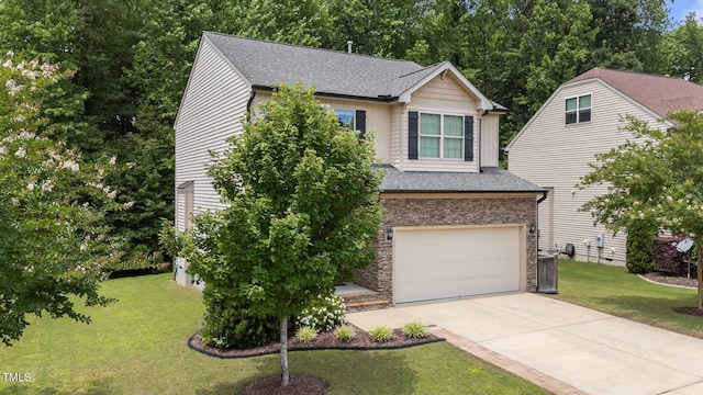 205 Willow Weald Ct, Fuquay Varina, NC 27526 - view of front of house with concrete driveway, a garage, a front lawn, a shingled roof, and stone siding