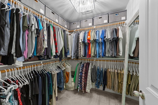 205 Willow Weald Ct, Fuquay Varina, NC 27526 - walk in closet with carpet flooring and a chandelier