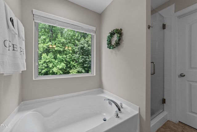 205 Willow Weald Ct, Fuquay Varina, NC 27526 - bathroom with a stall shower, a garden tub, and tile patterned floors
