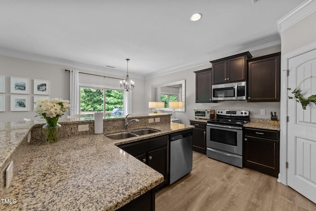205 Willow Weald Ct, Fuquay Varina, NC 27526 - kitchen with stainless steel appliances, a sink, a chandelier, dark brown cabinetry, and light stone countertops