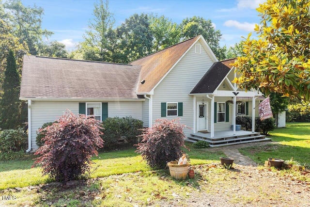 3298 Oakridge Dr Unit A, Graham, NC 27253 - view of front facade with a porch, a front lawn, and a shingled roof