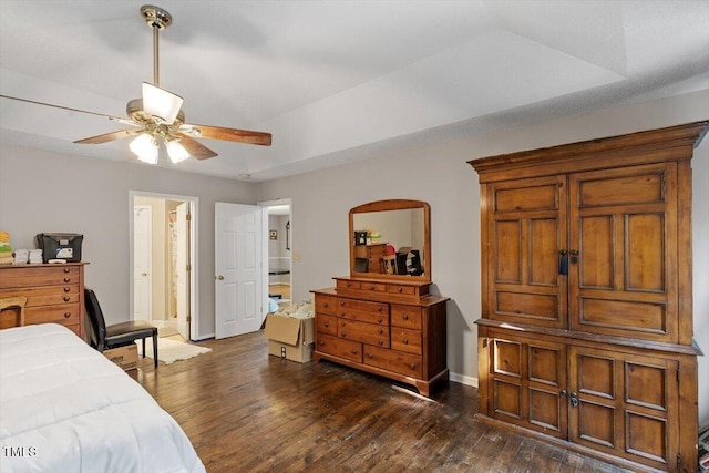 3298 Oakridge Dr Unit A, Graham, NC 27253 - bedroom with dark wood-style flooring, baseboards, ceiling fan, and ensuite bath