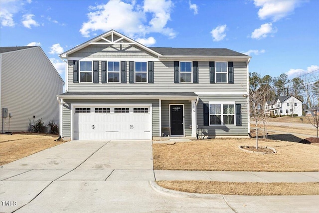 1004 Bridgewater Dr, Durham, NC 27704 - view of front of home with concrete driveway, a garage, and a front yard