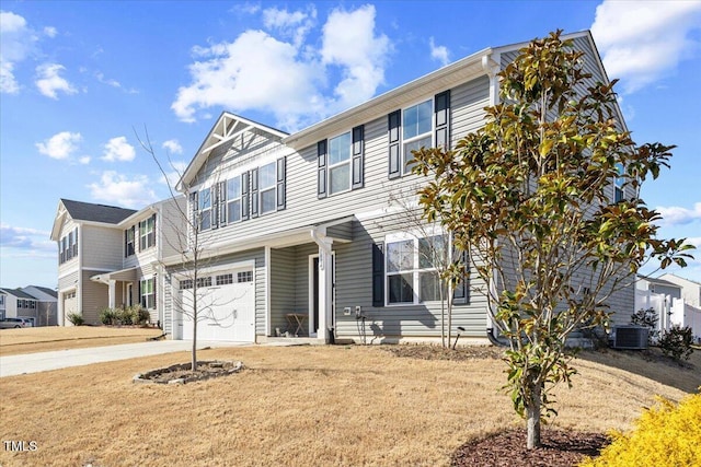 1004 Bridgewater Dr, Durham, NC 27704 - townhome / multi-family property featuring a garage, driveway, and central AC unit