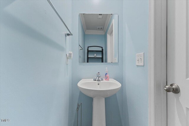 1004 Bridgewater Dr, Durham, NC 27704 - bathroom featuring ornamental molding
