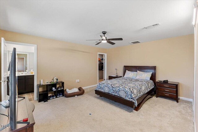 1004 Bridgewater Dr, Durham, NC 27704 - bedroom featuring light colored carpet, baseboards, a spacious closet, a ceiling fan, and a closet