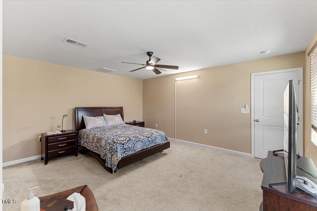 1004 Bridgewater Dr, Durham, NC 27704 - bedroom with light colored carpet, ceiling fan, and baseboards