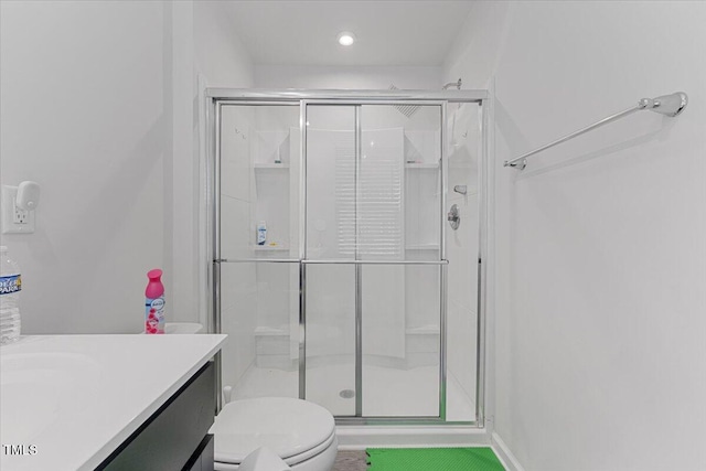 1004 Bridgewater Dr, Durham, NC 27704 - full bathroom with a shower stall, toilet, vanity, and recessed lighting