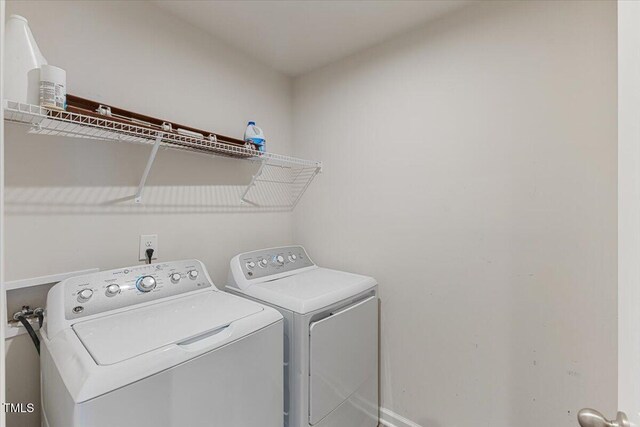 1004 Bridgewater Dr, Durham, NC 27704 - washroom featuring independent washer and dryer and baseboards