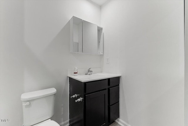 1004 Bridgewater Dr, Durham, NC 27704 - half bath featuring toilet, vanity, and baseboards