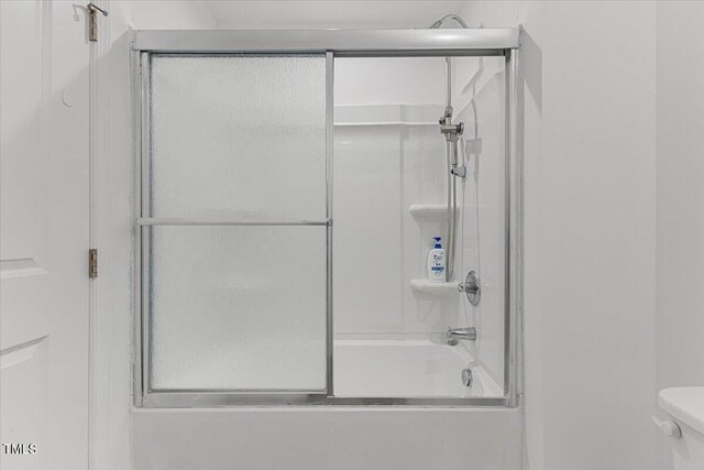 1004 Bridgewater Dr, Durham, NC 27704 - bathroom with enclosed tub / shower combo and toilet