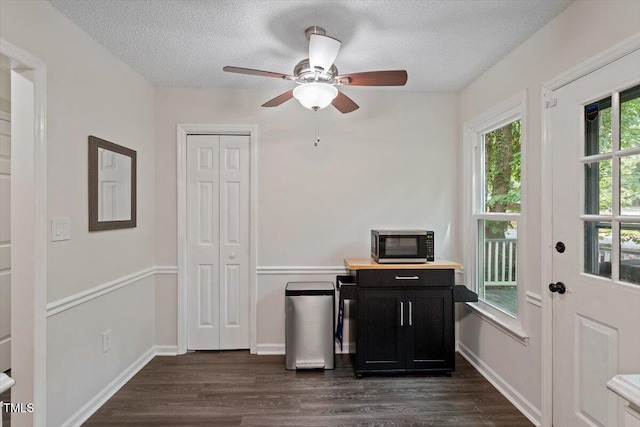 1 Old Towne Pl, Durham, NC 27713 - interior space featuring dark cabinetry, dark wood-style floors, ceiling fan, a textured ceiling, and light countertops