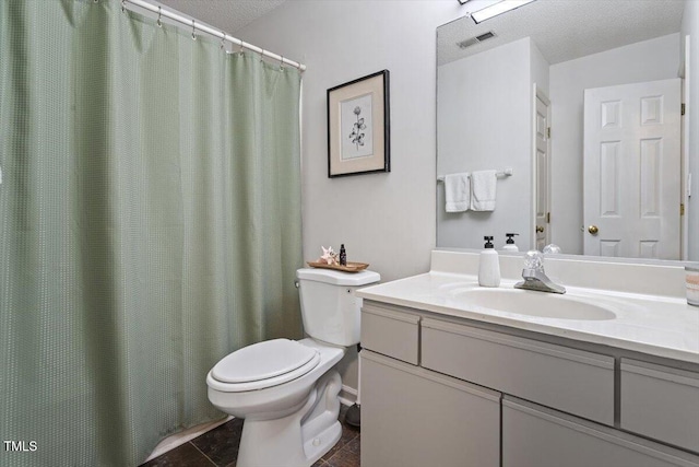 1 Old Towne Pl, Durham, NC 27713 - bathroom with toilet, vanity, and a textured ceiling
